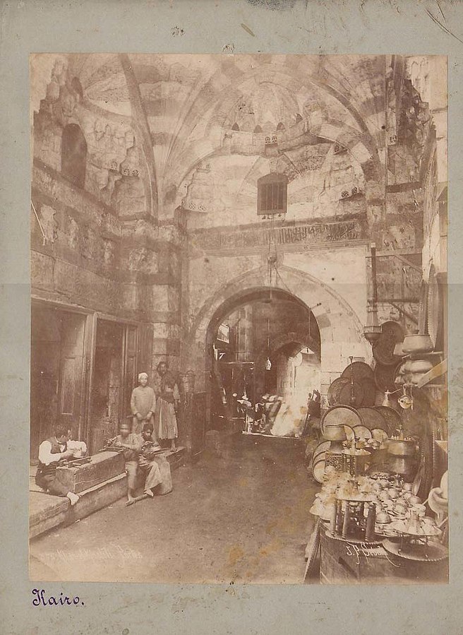656px-Sebah,_Pascal_(1823-1886)_-_Khan_el-Khalili,_Cairo_-_ca._1880s.jpg